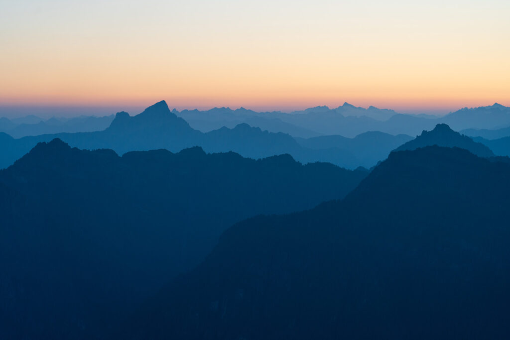 layers of mountains from the summit of vesper peak